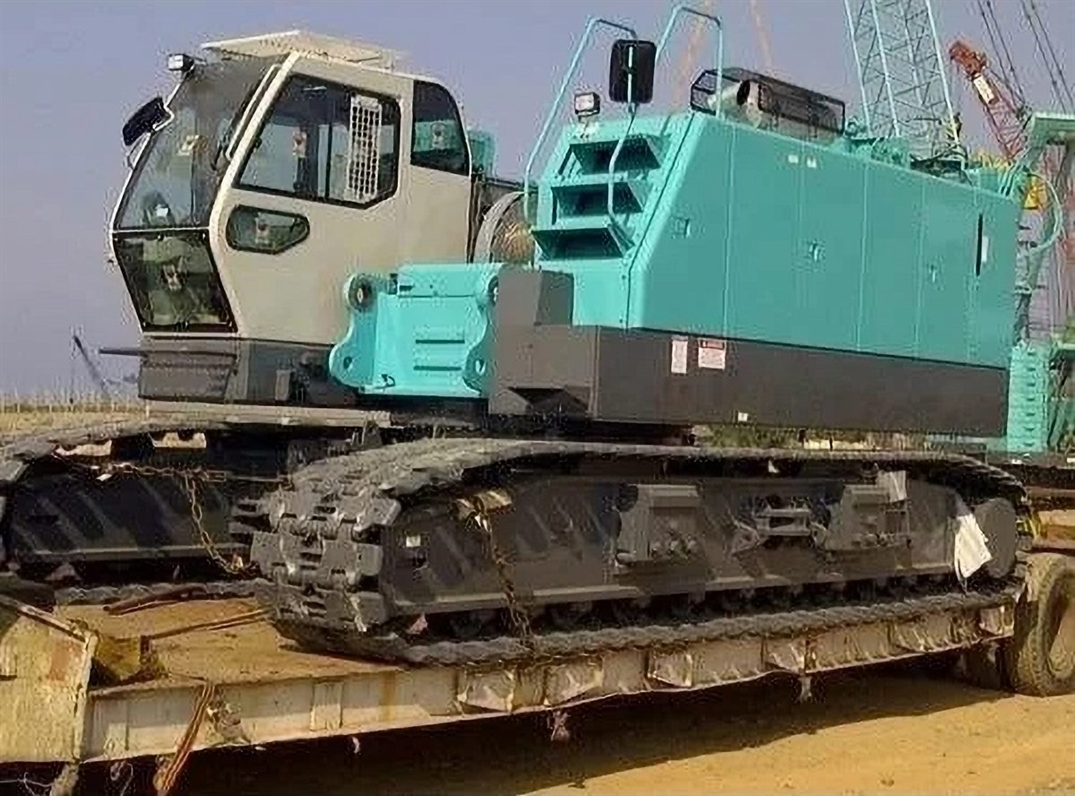 Crawler crane loaded onto a trailer for transport to site